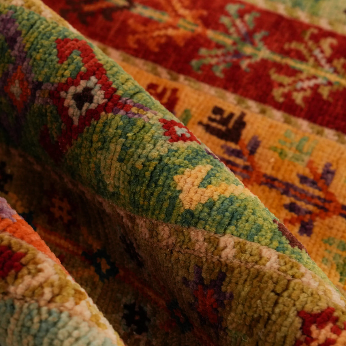 Anadolu Şal Series cream-field stripe-pattern rug — close-up from above of khaki, orange and red stripes