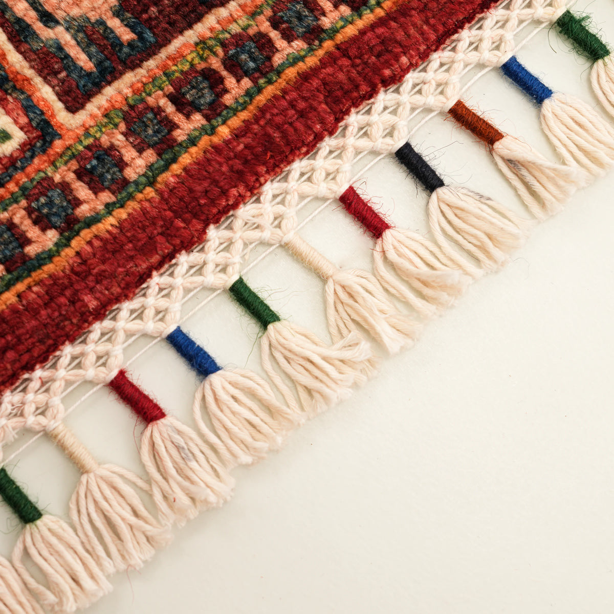 Şahzade Series blue-and-red patterned rug — fringe macro, cream tassels with colored wrapping