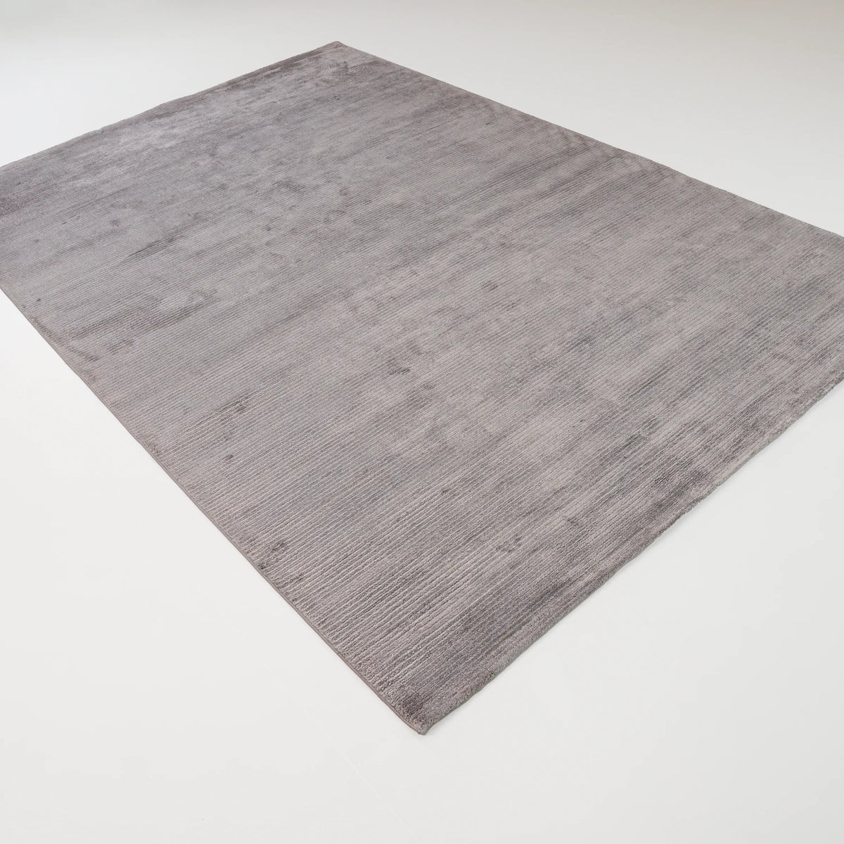 Soft Line Series striped rug — full length from the other angle, the corners running out of the frame