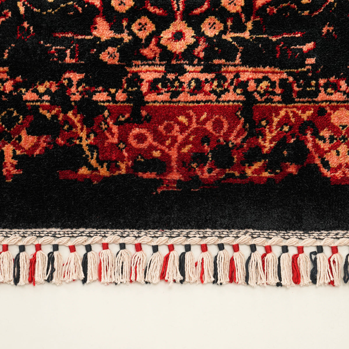 Zade Series vintage-patterned rug — macro, border motifs and red-and-black tassels