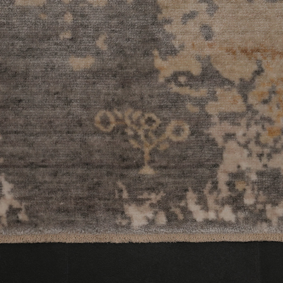 Zima Series mustard-circle gray geometric rug — field macro, the woven signature and the weathering around it