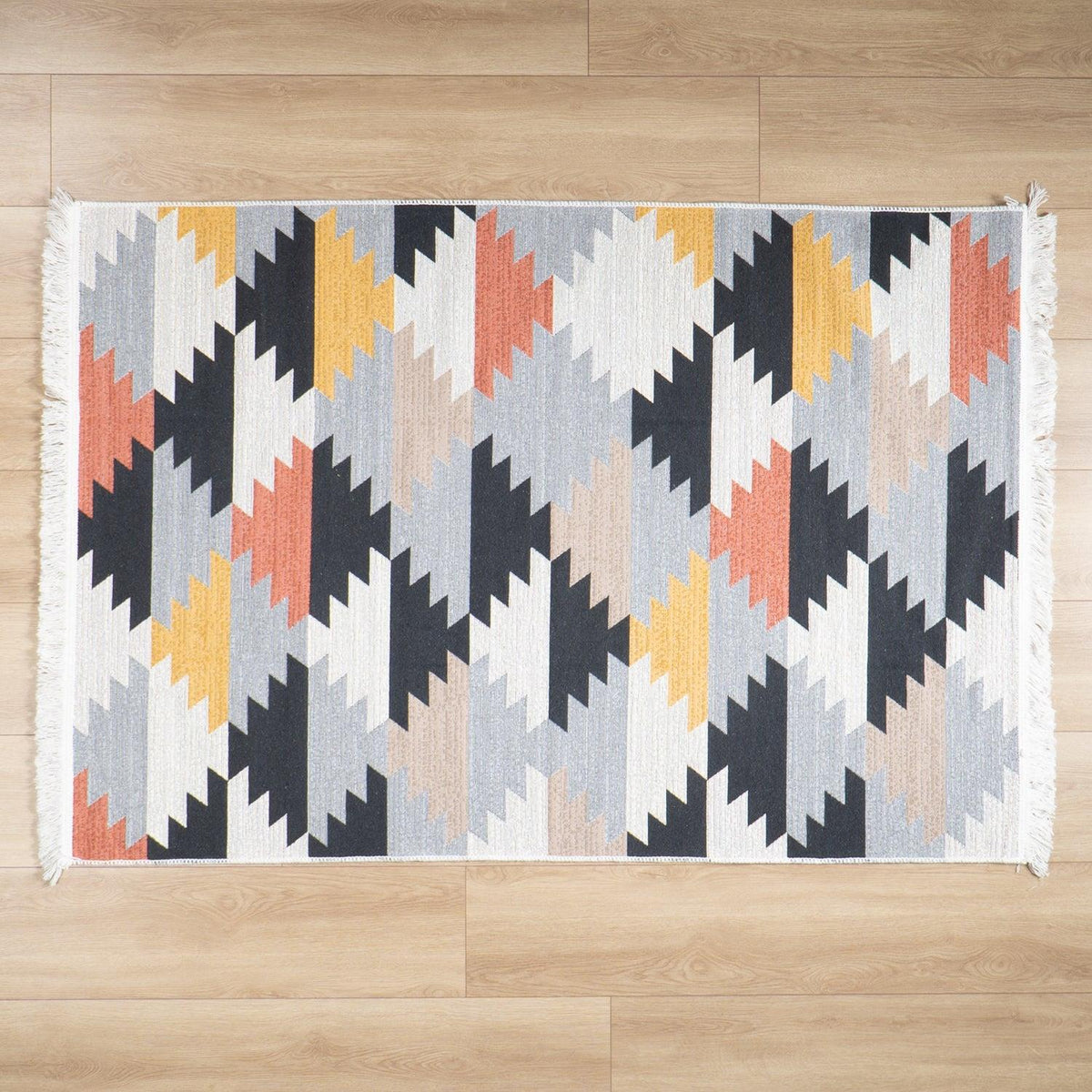 Kehribar Series multicolor geometric kilim — small mat from above at the center of the parquet, clear all around