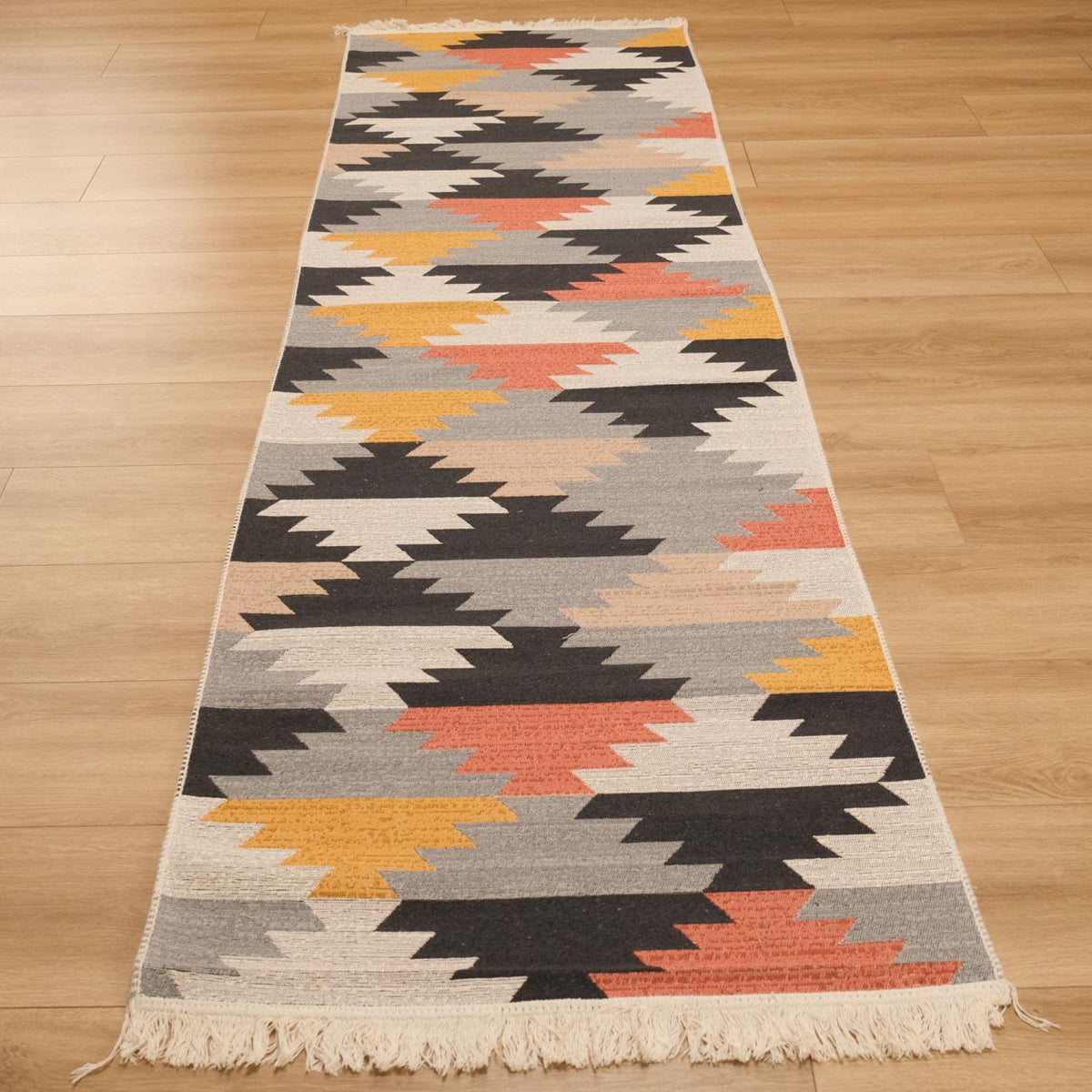 Kehribar Series multicolor geometric kilim — long runner from one end, motifs shrinking in perspective